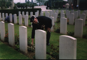 Len Butt Laying a wreath on the Grave of Sgt J.A.Brown R.E.
